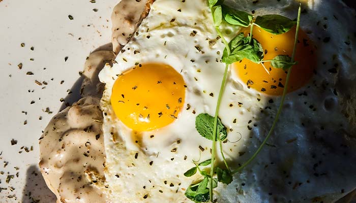ERA Cafe in Waunakee, WI Two sunny-side-up eggs on toast with herbs—your Best Breakfast in Waunakee, Wisconsin!.