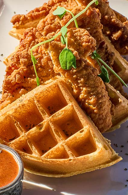 ERA Cafe in Waunakee, WI Close-up of crispy fried chicken on waffles, perfect for Breakfast Brunch & Lunch in Waunakee Wisconsin.