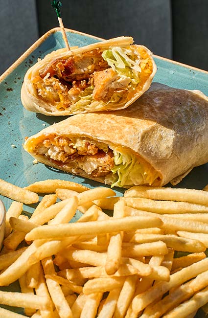 ERA Cafe in Waunakee, WI Lettuce and chicken wrap served with crispy fries—perfect for Breakfast Brunch & Lunch in Waunakee.