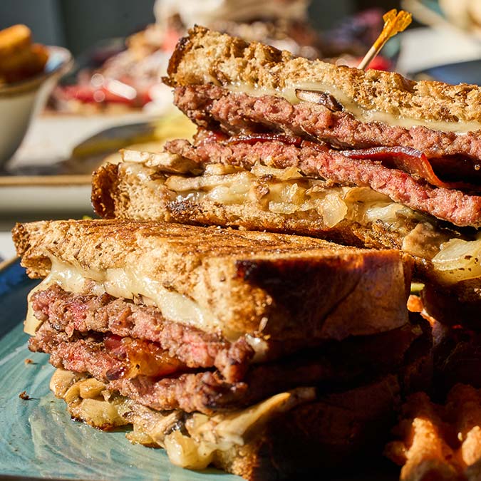 ERA Cafe in Waunakee, WI Close-up of a stacked grilled sandwich at Breakfast Brunch & Lunch in Waunakee Wisconsin.