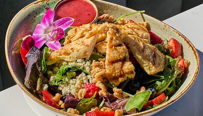 ERA Cafe in Waunakee, WI Grilled chicken salad with strawberries, walnuts, cheese, and greens—perfect lunch in Wausau Wisconsin.