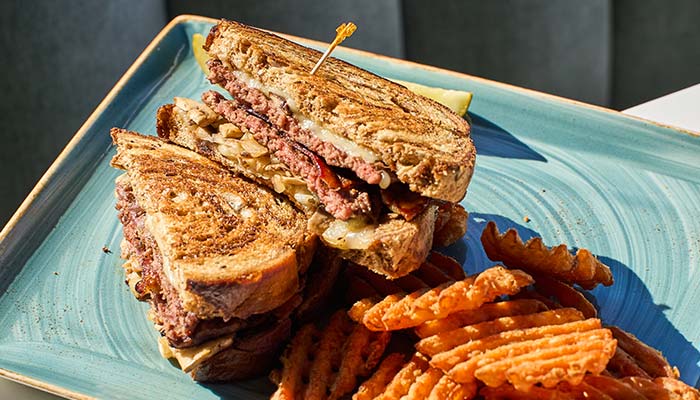 ERA Cafe in Waunakee, WI A patty melt sandwich with crinkle-cut fries—a classic lunch in Wausau, Wisconsin.