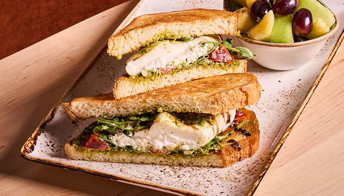 ERA Cafe in Waunakee, WI Grilled sandwich with cheese, greens, and pesto—perfect for lunch in Wausau, Wisconsin.